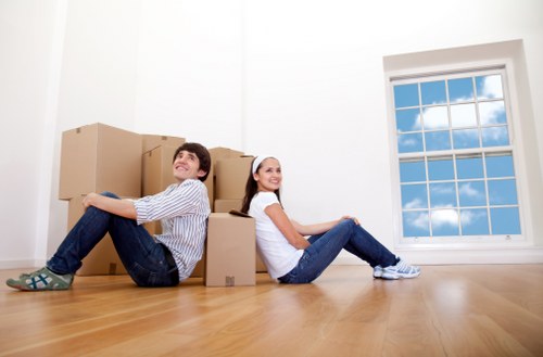 Satisfied customer finalizing a furniture pick-up service in Surrey