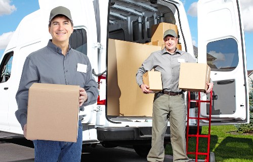Professional team handling furniture with care during pick-up