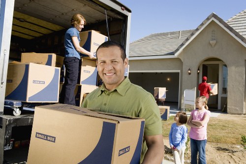 Professional driver loading a removal truck in Surrey